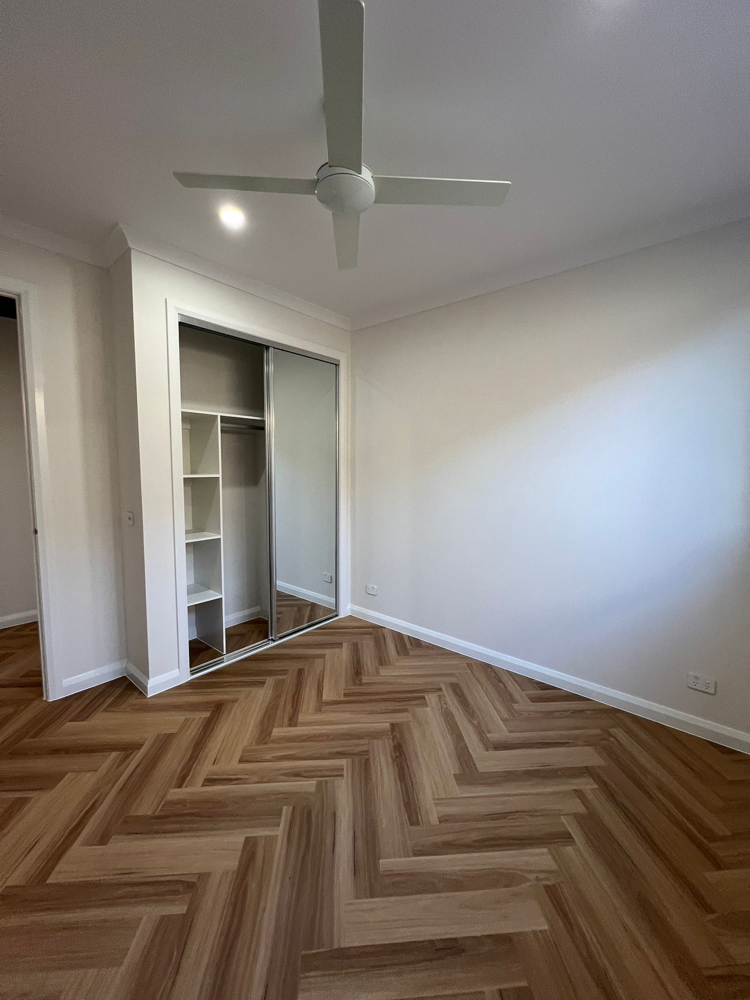 Bedroom with built-in wardrobe at Lynwood St Manor Lakes project by Keshar Constructions