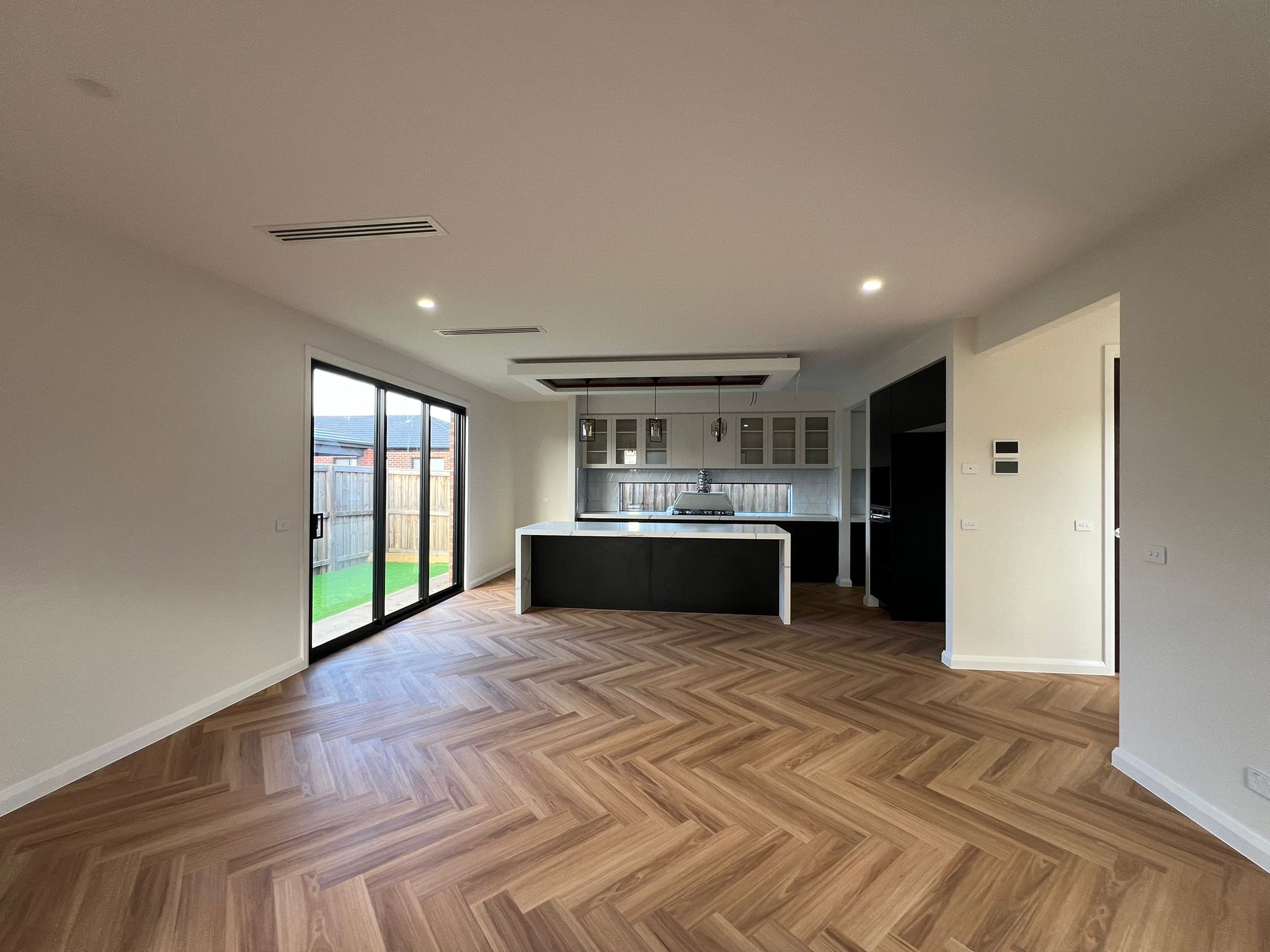 Open living and kitchen area at Lynwood St Manor Lakes project by Keshar Constructions