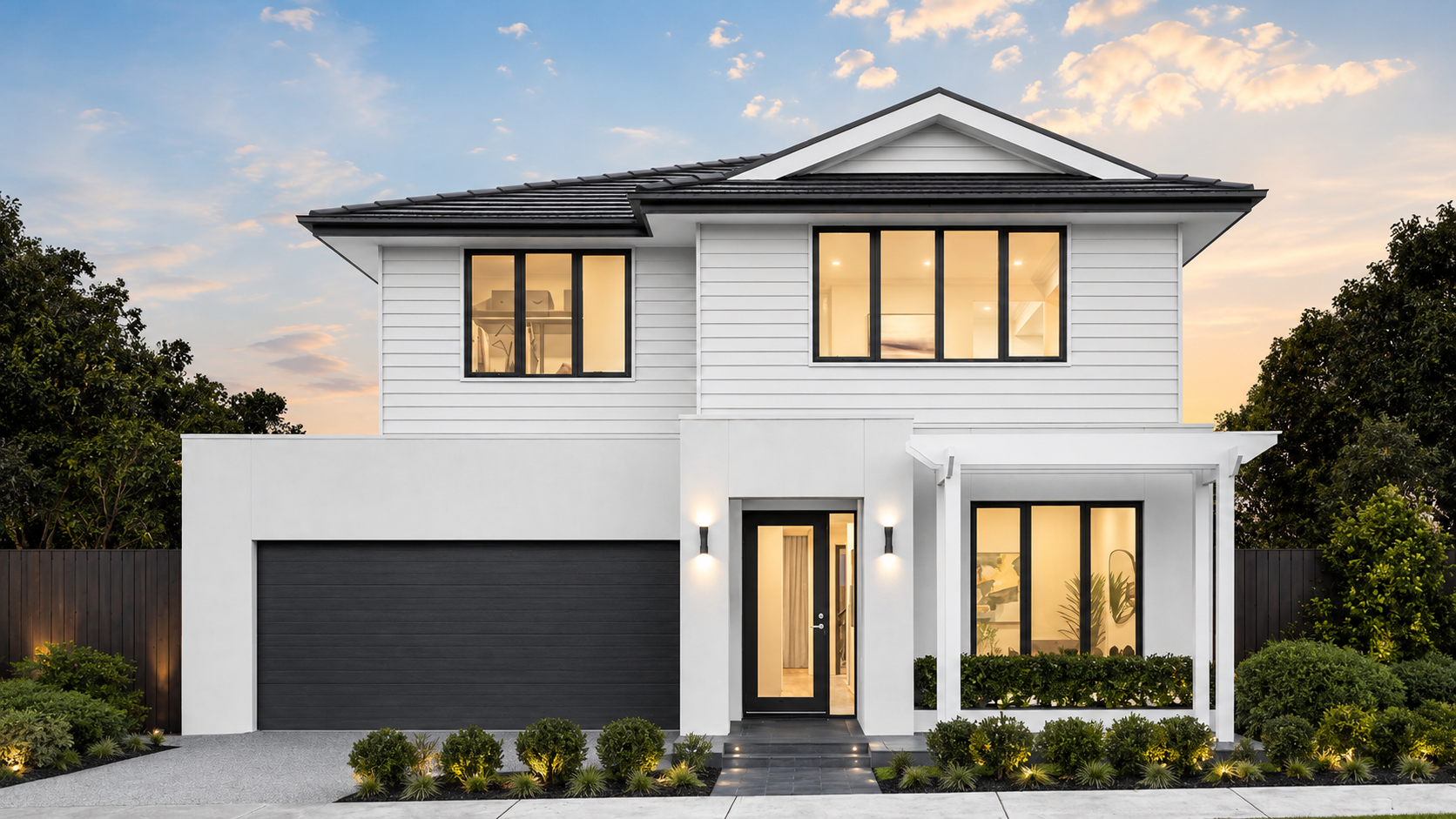 White double-storey facade with a central gable, dark garage and columned ground-floor porch